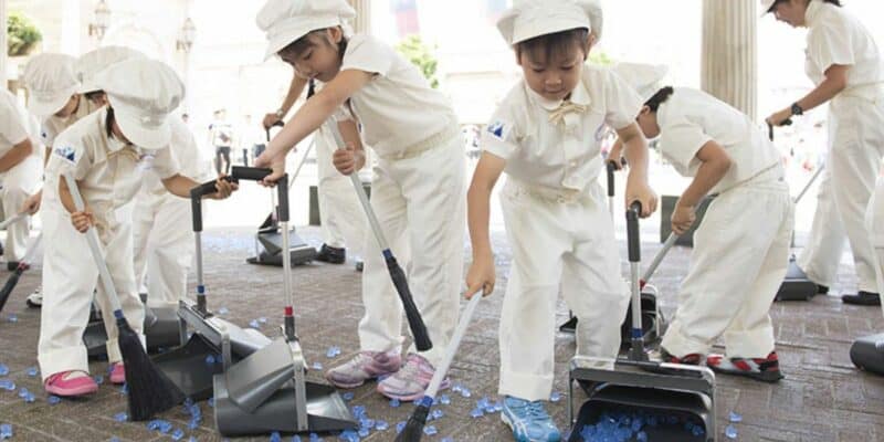 Children sweep as Custodial Cast Members at Tokyo Disney