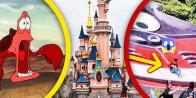 A young child walks on and slides down a Cheshire Cat Topiary at Disneyland Paris on the right, shocked Sebastian from 'The Little Mermaid' on the left and Disneyland Castle in the middle