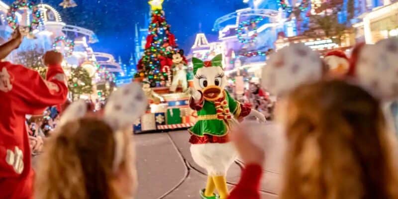 Daisy Duck walks through Mickey's Once Upon a Christmastime Parade
