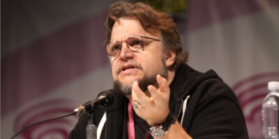 Guillermo del Toro speaking seriously at a panel