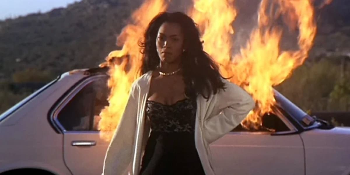 Angela Bassett in front of a burning car in Waiting To Exhale