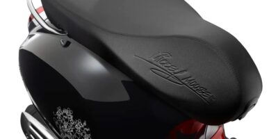 Mickey Mouse signed his name on the seat of a Vespa