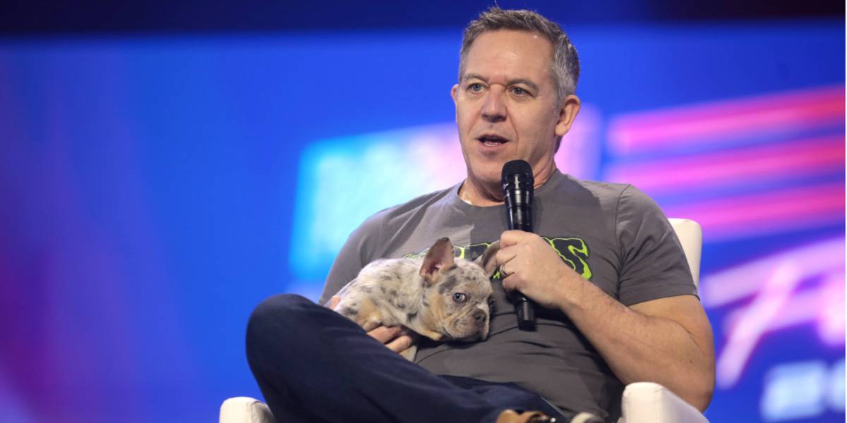 Greg Gutfeld holding a dog