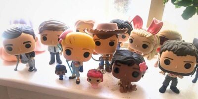 A collection of Funko Pops including Little Bo Peep and Woody of Toy Story, Moana, Elle Woods, and characters from The Office and Ouran High School Host Club