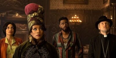 Characters look up in 'Haunted Mansion' (2023)