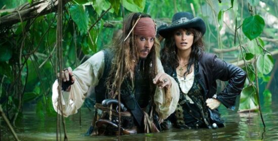 Jack Sparrow and Angelica wade through the water
