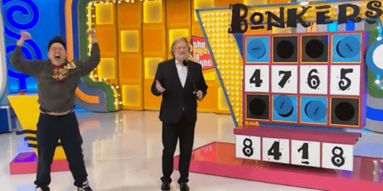 Henry and Drew Carey celebrating on 'The Price is Right.' 