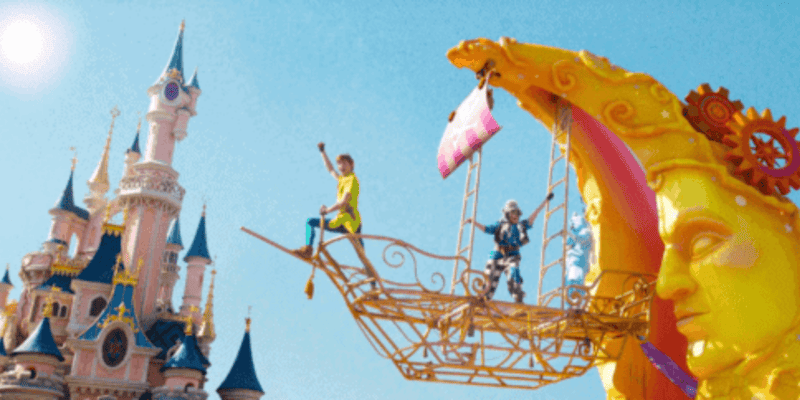 Peter Pan on a moon-shaped float in front of Sleeping Beauty Castle at Disneyland Paris.