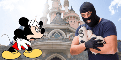 Mickey Mouse looks scared of a robber in front of Disneyland Paris's Sleeping Beauty Castle, representing a new disneyland scam.