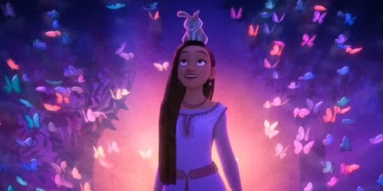 Asha (Ariana DeBose) stands amidst colorful butterflies in 'Wish'