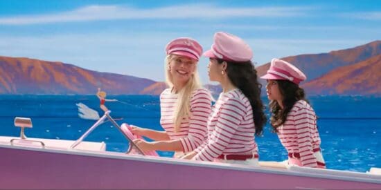 Margot Robbie and America Fererra on a pink speedboat barbie movie barbieland