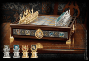 Harry Potter chess set featuring intricately crafted house crest pieces on a decorative wooden board, just like the magical sets showcased at Universal Orlando Resort.