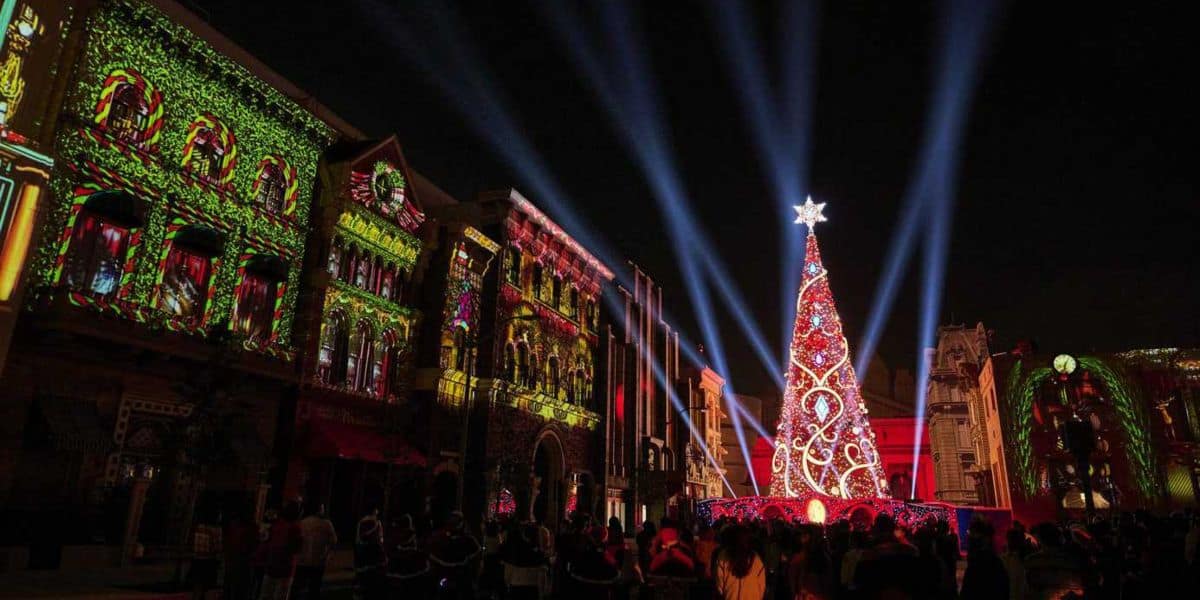 Christmas tree lights up at nighttime Universal Studios Japan