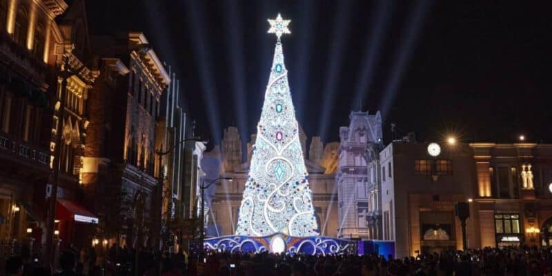 Christmas tree lights up white at nighttime Universal Studios Japan