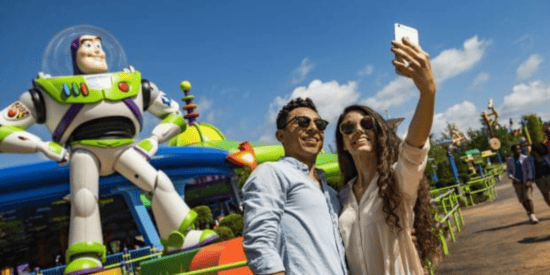 Couple taking selfie in Toy Story Land