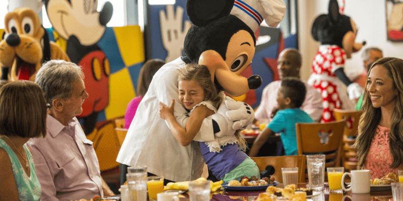 Chef Mickey's scene with Mickey hugging a small girl at breakfast