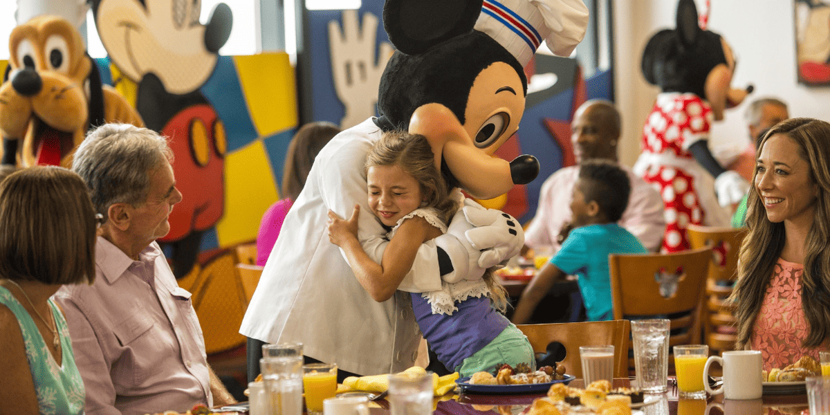 Chef Mickey's scene with Mickey hugging a small girl at breakfast