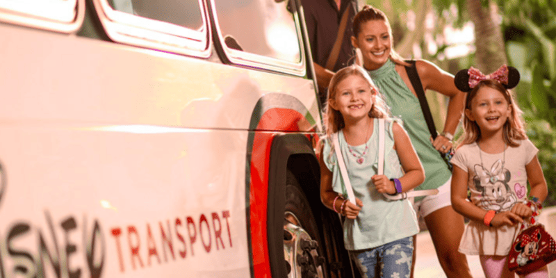 Woman and children disembarking Disney transportation