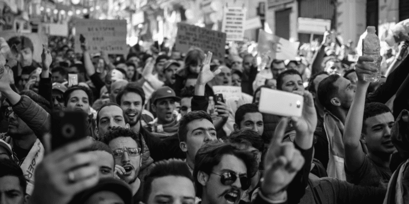 Crowd of people protesting implying Major Plans from Disney being delayed. Photo by Amine M'siouri from Pexels: https://www.pexels.com/photo/crowd-of-people-black-and-white-photo-2246258/