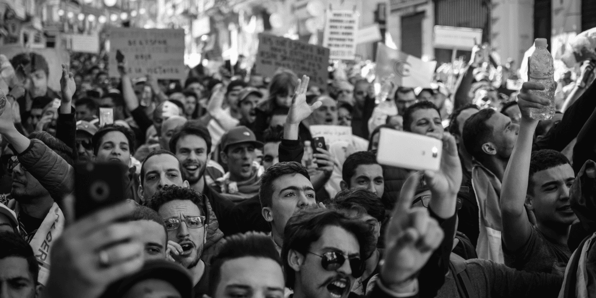 Crowd of people protesting implying Major Plans from Disney being delayed. Photo by Amine M'siouri from Pexels: https://www.pexels.com/photo/crowd-of-people-black-and-white-photo-2246258/