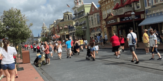 Walt Disney World crowds walking down Main Street, USA.