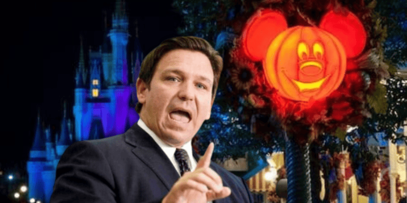 Ron DeSantis shakes his finger in front of Disney Halloween decorations at Magic Kingdom.