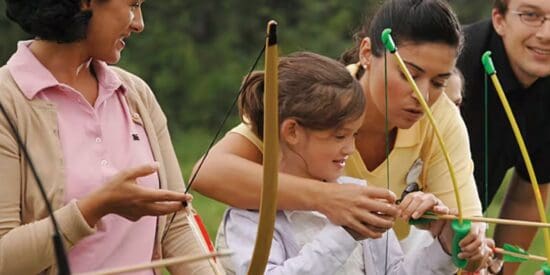 Guests trying Fort Wilderness Resort Archery