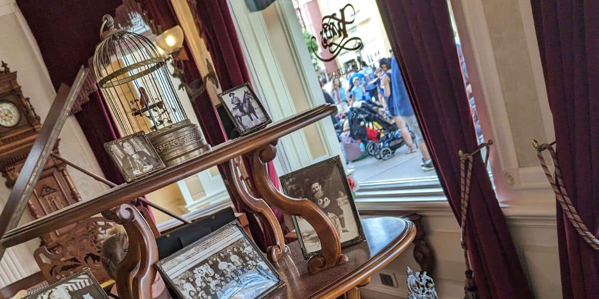 Disneyland Paris' Walt's: An American Restaurant foyer with pictures of Walt Disney, looking out to Guests on Main Street
