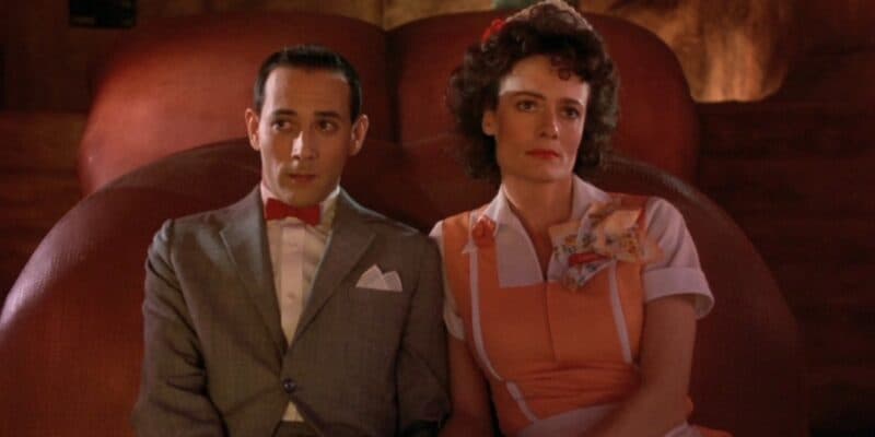 Pee-Wee Herman and Simone in the dinosaur mouth