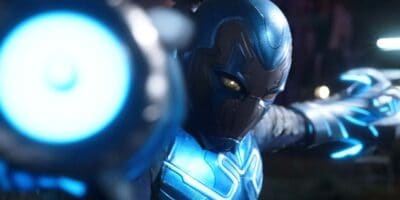 Blue Beetle getting ready to fire his arm cannon