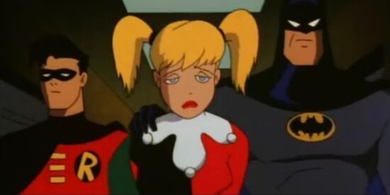 Harley Quinn sad while being taken away by Batman and Robin