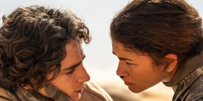 Zendaya holds Timothee Chalemet's face in a still from 'Dune'
