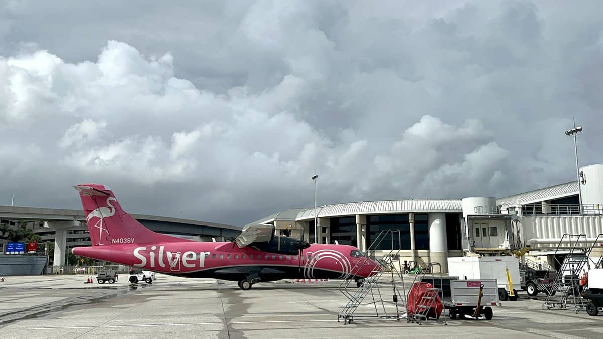 An airplane inside of the Tampa International Airport terminal preparing for departure