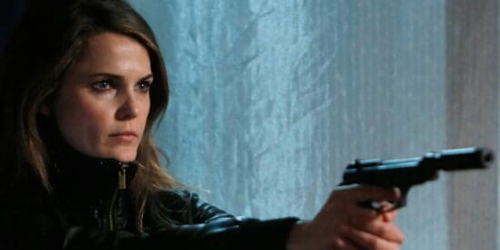 Keri Russell in The Americans holding a gun
