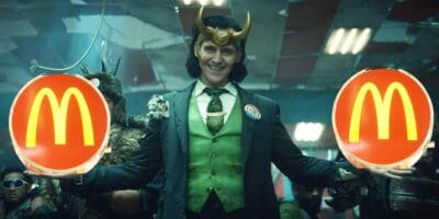 Loki (Tom Hiddleston) holding two McDonald's logos