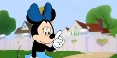 Minnie Mouse standing with her finger up