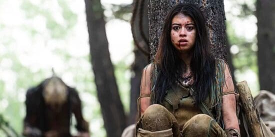 Amber Midthunder hiding from Predator in Prey