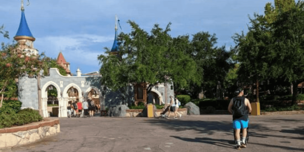A lone Guest walking through Fantasyland in Magic Kingdom as Walt Disney World crowds plummet.