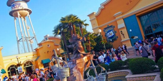 Guests walking around the front entrance of Walt Disney Studios Park at Disneyland Paris