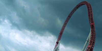 Storm clouds appear high above a roller coaster located inside Hersheypark