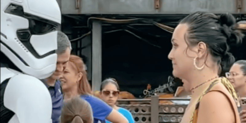 A Stormtrooper and a woman in Star Wars land, also known as Star Wars: Galaxy's Edge.