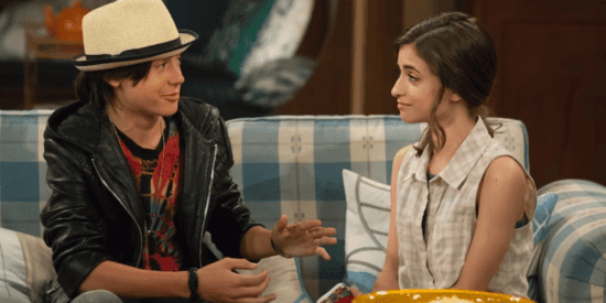 Isaak Presley sits on a couch on Fuller House.