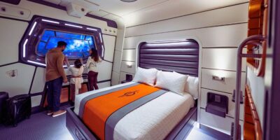 A family in their room inside of Star Wars Galactic Starcruiser at Disney's Hollywood Studios in Walt Disney World Resort
