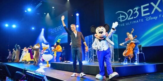 Disney Parks Chairman Josh D'Amaro and joins Mickey Mouse and the rest of the gang on the 2022 D23 stage