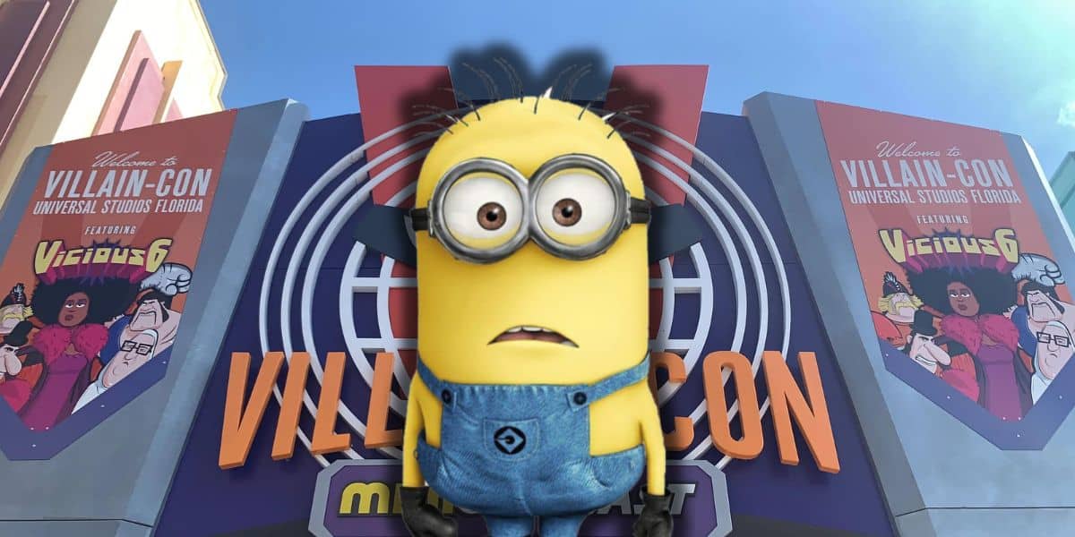 A surprised minion in front of the Villain-Con Minion Blast sign inside of Universal Studios Florida