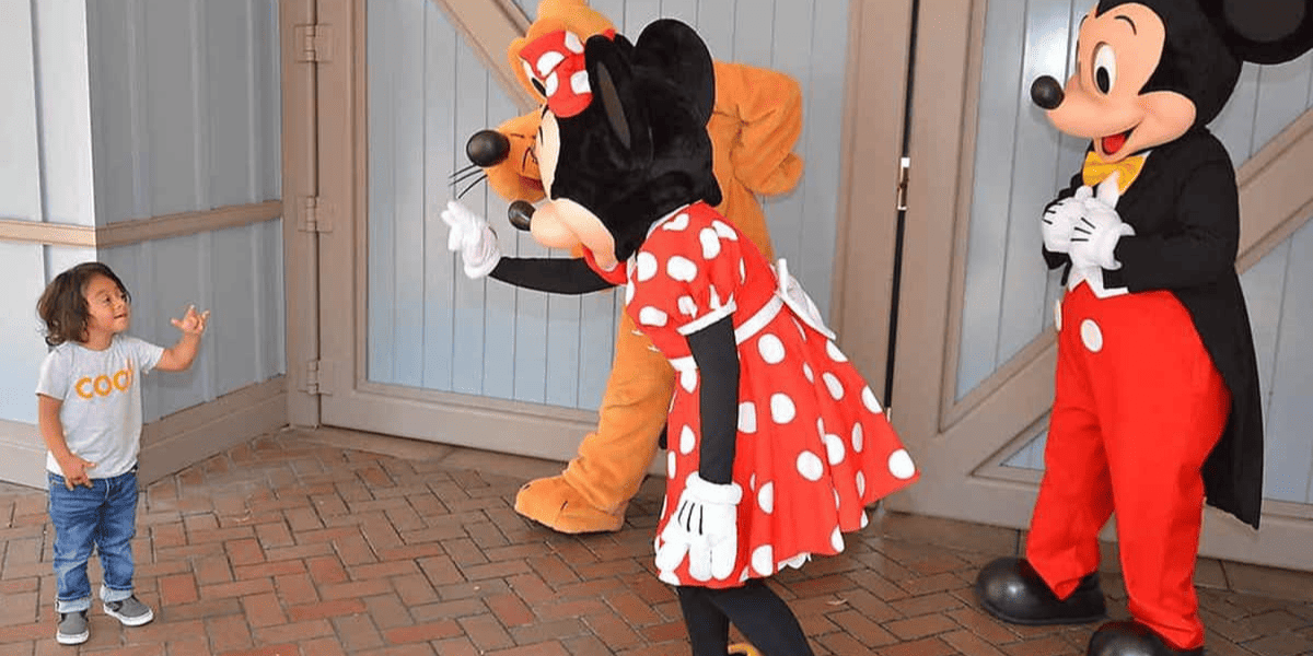 Deaf child signing to Disney Characters