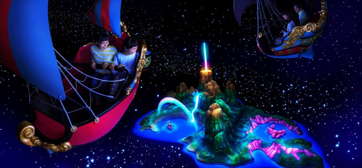Guests flying above Neverland aboard a pirate boat on Peter Pan's Flight, a beloved attraction at Tokyo Disneyland