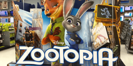 Cardboard Zootopia promotional image displayed in a store with electronics in the background