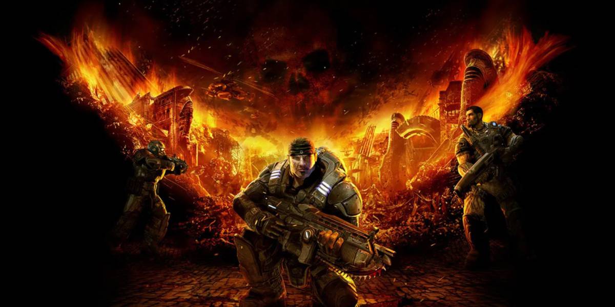 Marcus Fenix and his fellow soldiers standing in front of a flaming V for Gears of War