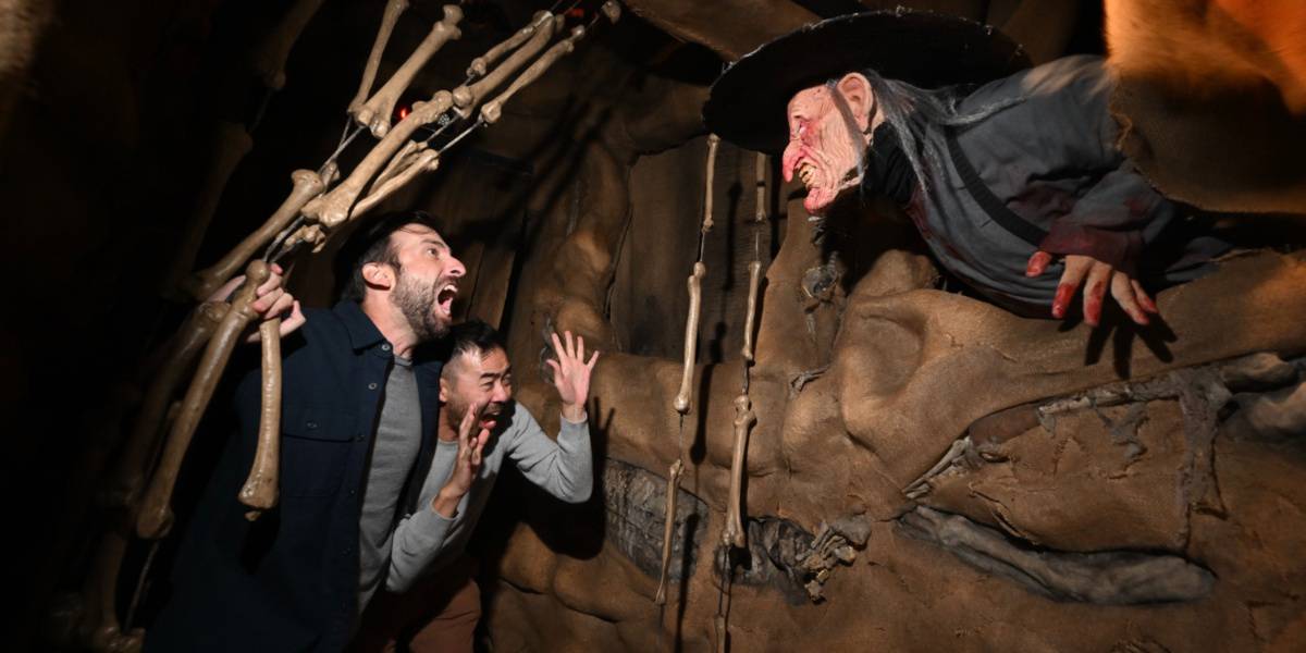 Guests being scared by a witch in the Los Monstruos house